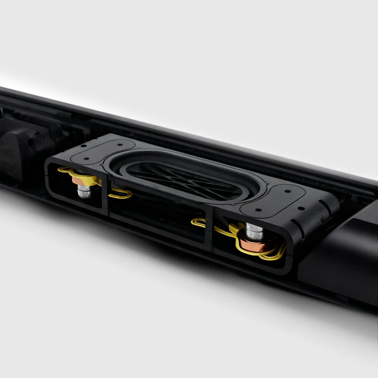 Close-up of a black Aeqis Wireless Soundbar with visible components on a white background