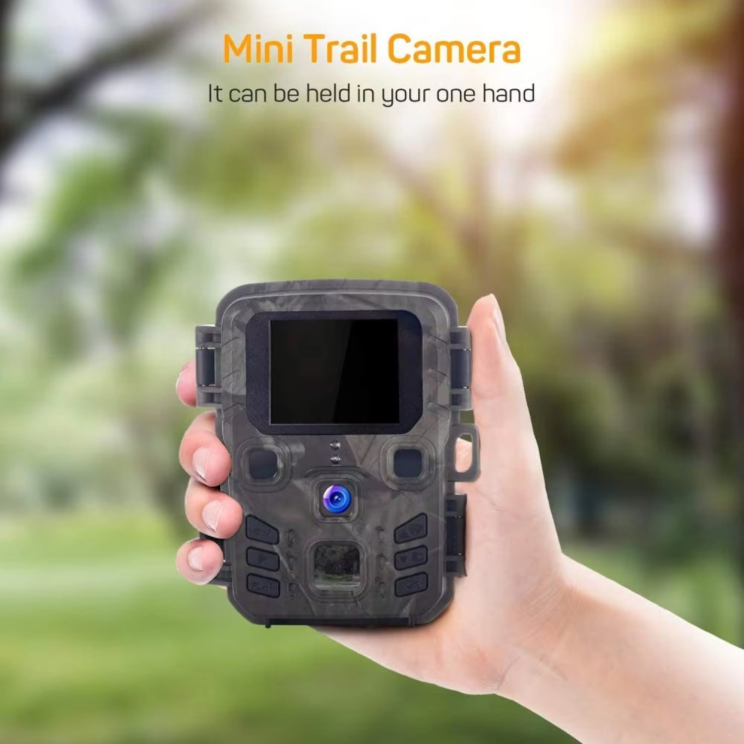 Hand holding a mini trail AethYrir Wildlife Camera with a blurred natural background