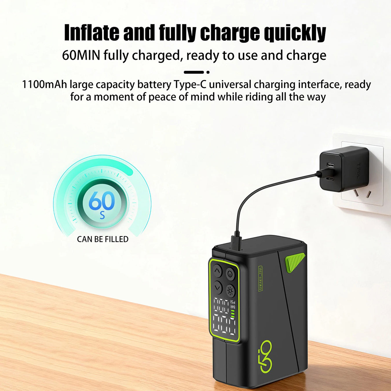 Power bank with charging cable connected to a wall outlet on a wooden surface.