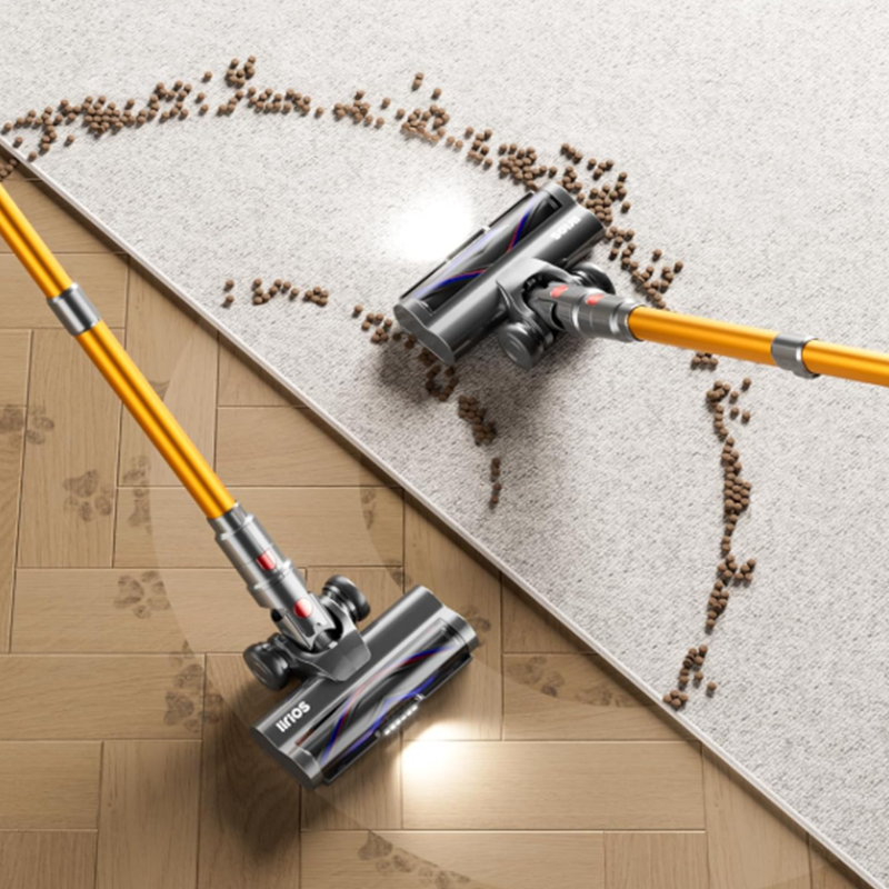 Auralink Vacuum Cleaner a carpet with coffee beans on a wooden floor.