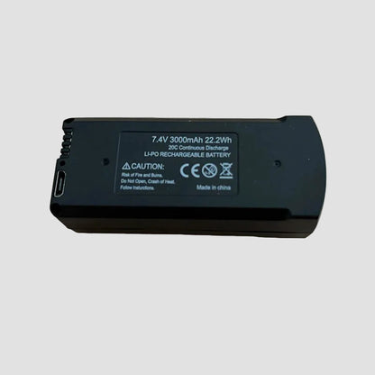Black battery pack Vassco GPS Drone Battery with label on a wooden surface