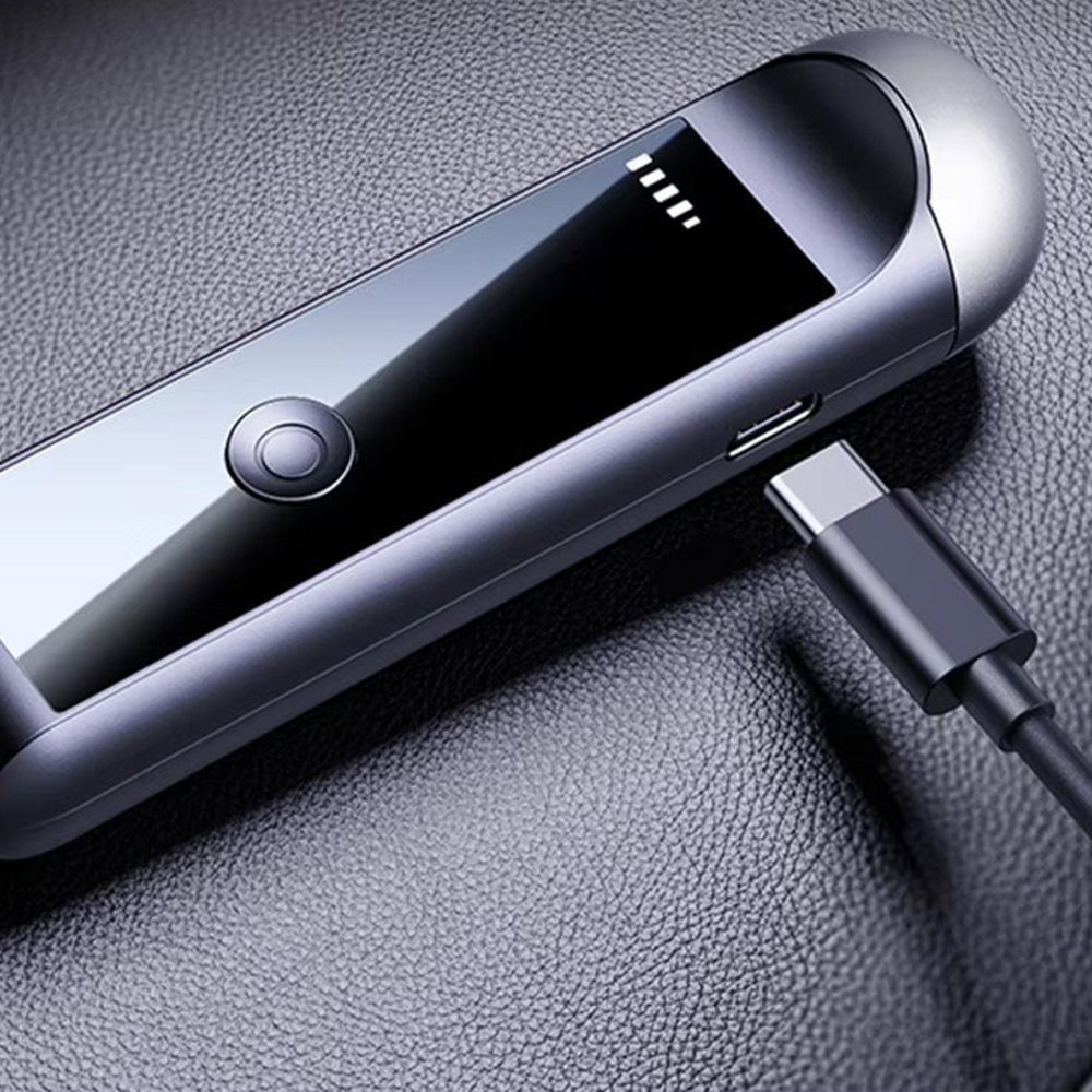 Bovallo LED Screen Breathalyser with a charging cable on a textured surface