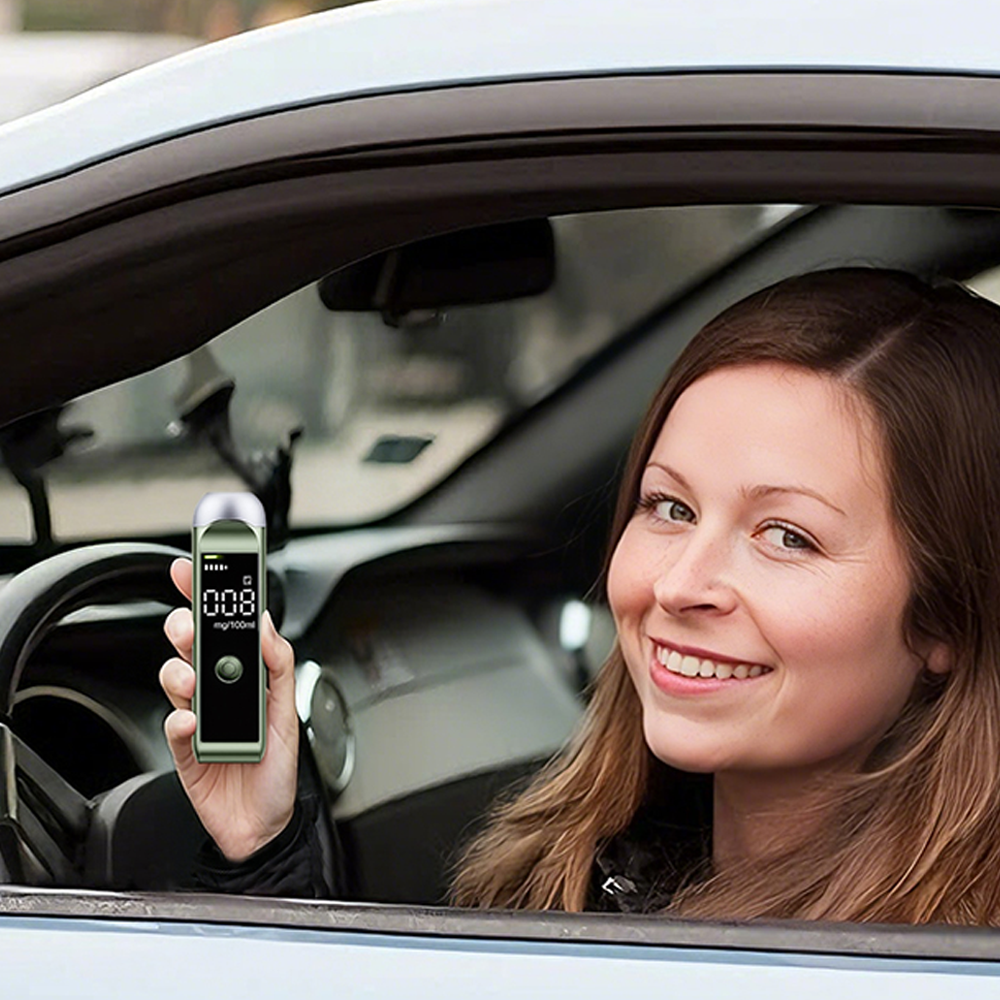 Woman in a car holding a Bovallo LED Screen Breathalyser device with a reading displayed.