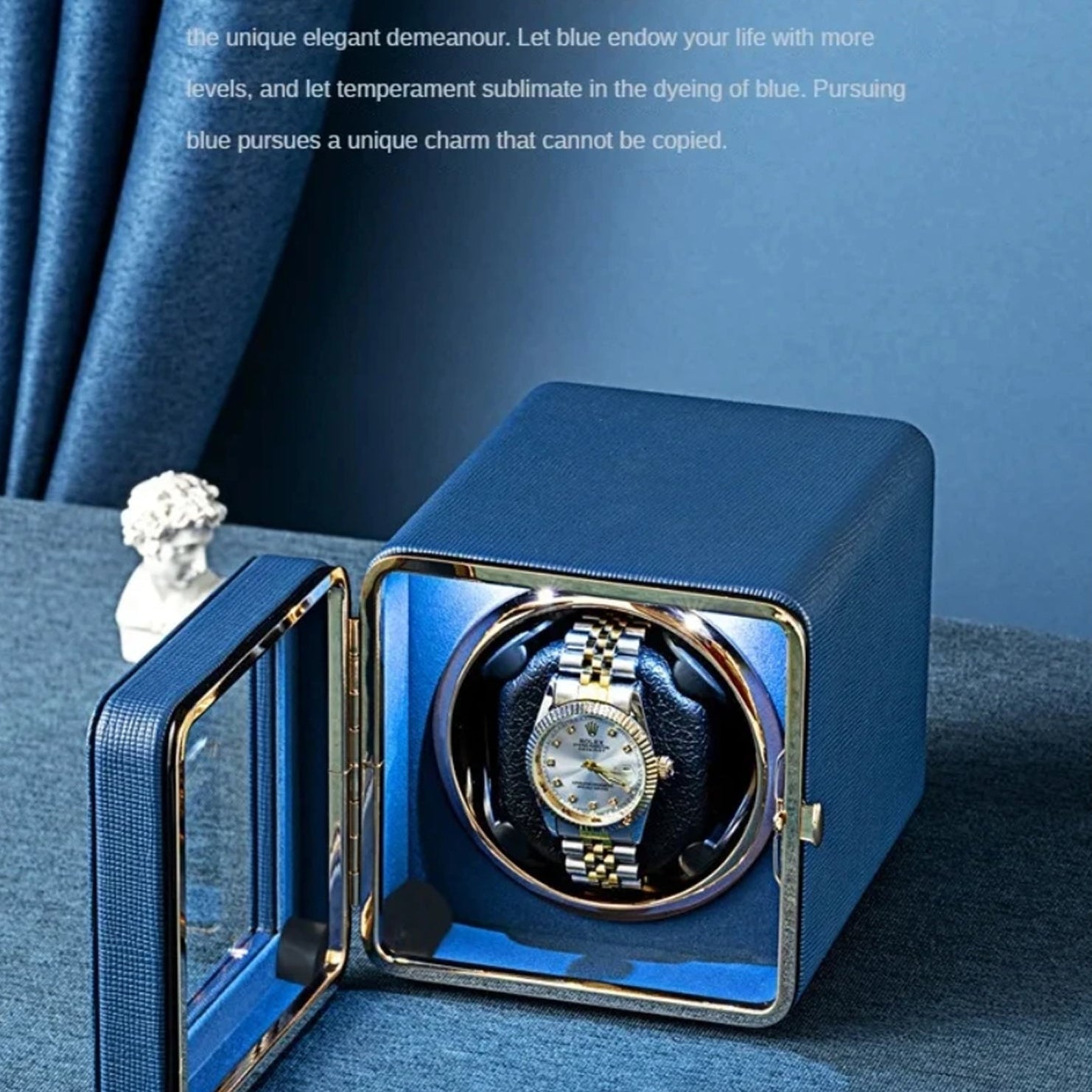 Blue ChroniNova Watch Winder with a watch inside on a blue background