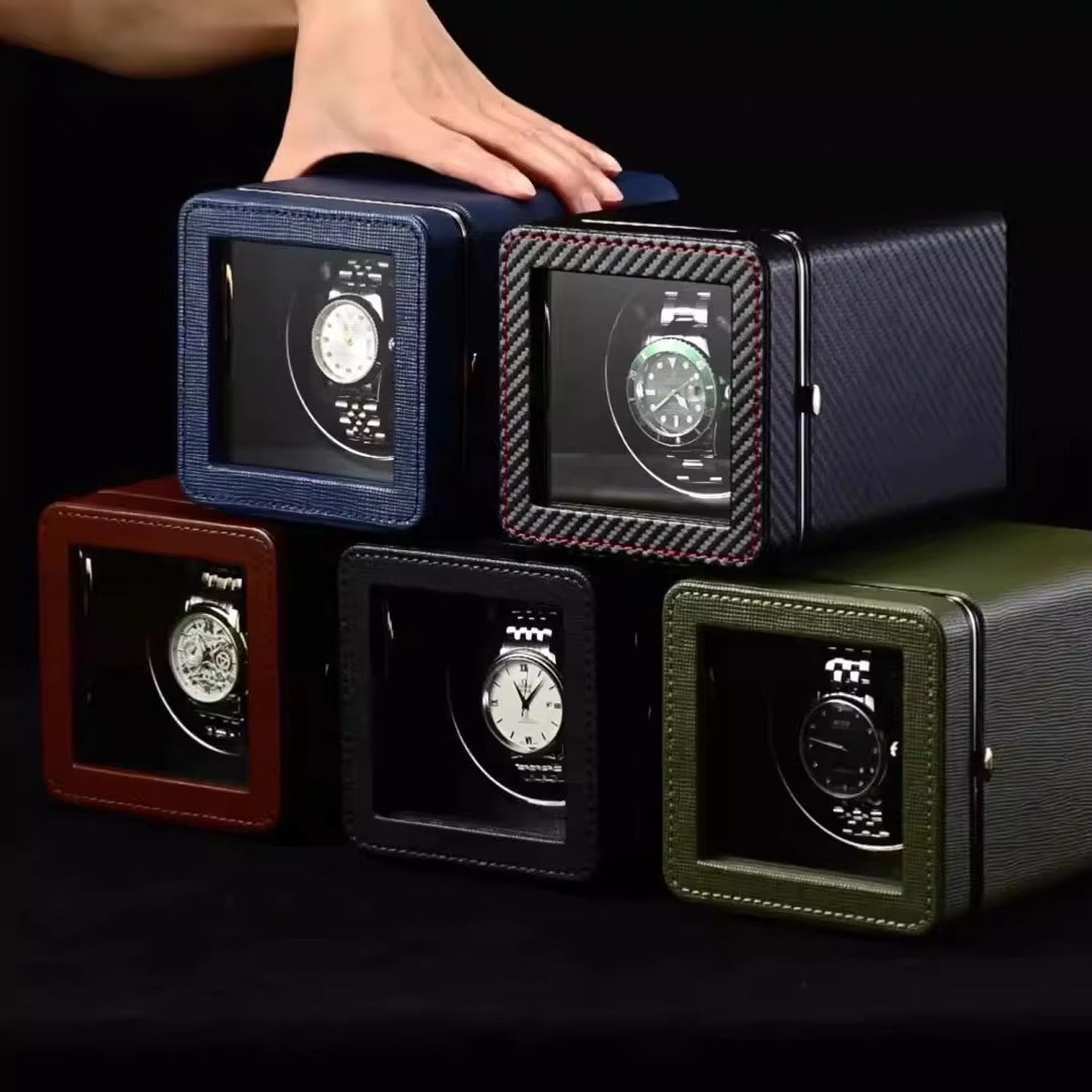 Collection of ChroniNova Watch Winder winders in various colors on a black background