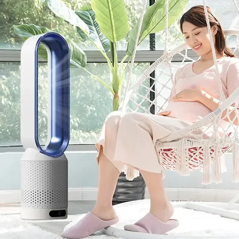 Woman sitting in a hammock next to a Dyson CoolLyxi Bladeless Fan.