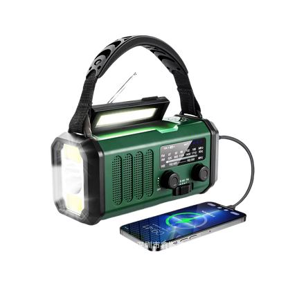 Green Crankoax Wind Up Radio with flashlight and phone charging cable on a white background