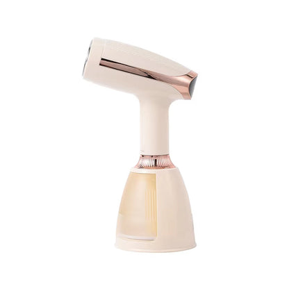 Rose gold CriisMist Handheld Steamer on a white background