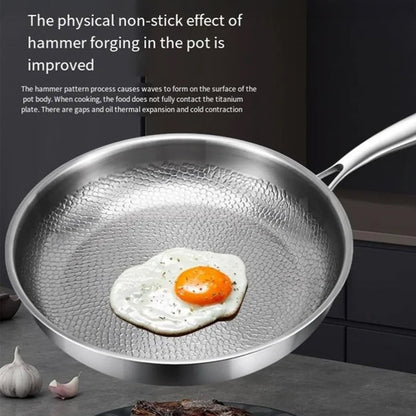 Crisporia Titanium Frying Pan with a fried egg on a kitchen counter