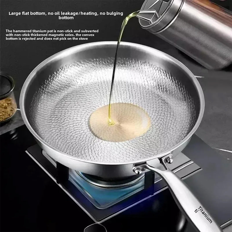 Crisporia Titanium Frying Pan with oil being poured on a stove
