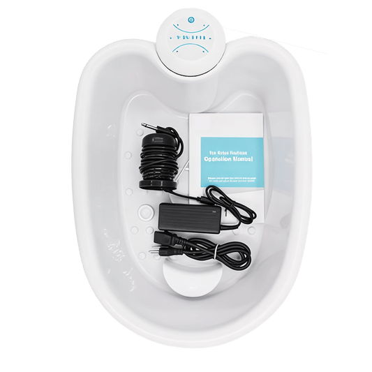 DetexFeet Ionic Foot Detox Machine with cables and a power adapter on a green background