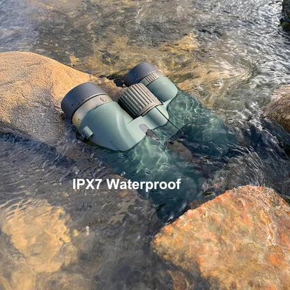 Divento Binoculars partially submerged in water with 'IPX7 Waterproof' text displayed.