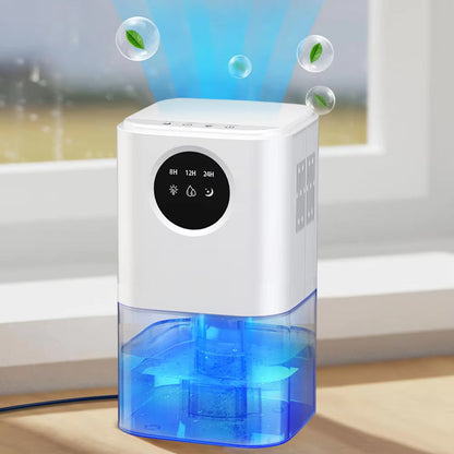 DryZon Dehumidifier with blue water tank and white body on a wooden surface.