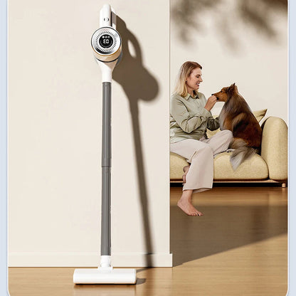 A DustiTrix Cordless Vacuum Cleaner stands upright on a wooden floor against a beige wall, with a split-screen lifestyle inset showing a woman sitting on a sofa and feeding a dog in the room.