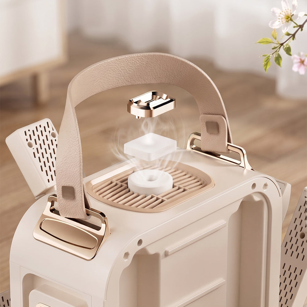 A close-up of a beige and rose gold pet carrier or suitcase with a top handle, ventilation grilles, and a floating diffuser insert emitting a soft mist, set against a blurred indoor background.