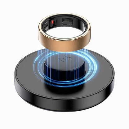 Gold Enviox Smart Ring levitating above a black circular base with blue light effects on a white background