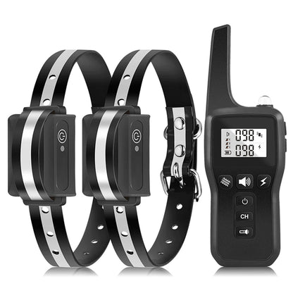 Two black GivaxMi Dog Training Collar with silver accents and a remote control on a white background