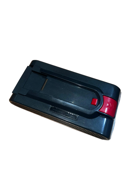 Black and red electronic device on a wooden surface