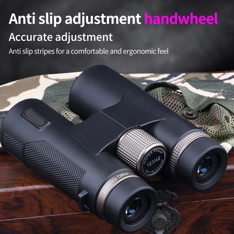 Black Kaisio Sky X7 ED 12×50 Binoculars with anti-slip adjustment handwheel on a camouflage-patterned surface.