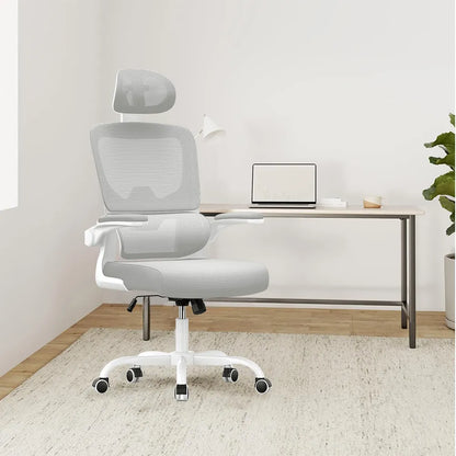 White Kalvori Ergonomic Office Chair in a minimalistic room with a desk and laptop.