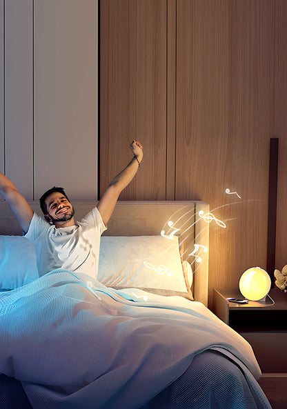 Man waking up in bed with a Kalvori nightlight on a nightstand