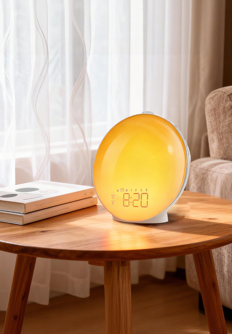 Yellow Kalvori Alarm Clock on a wooden table with a blurred background