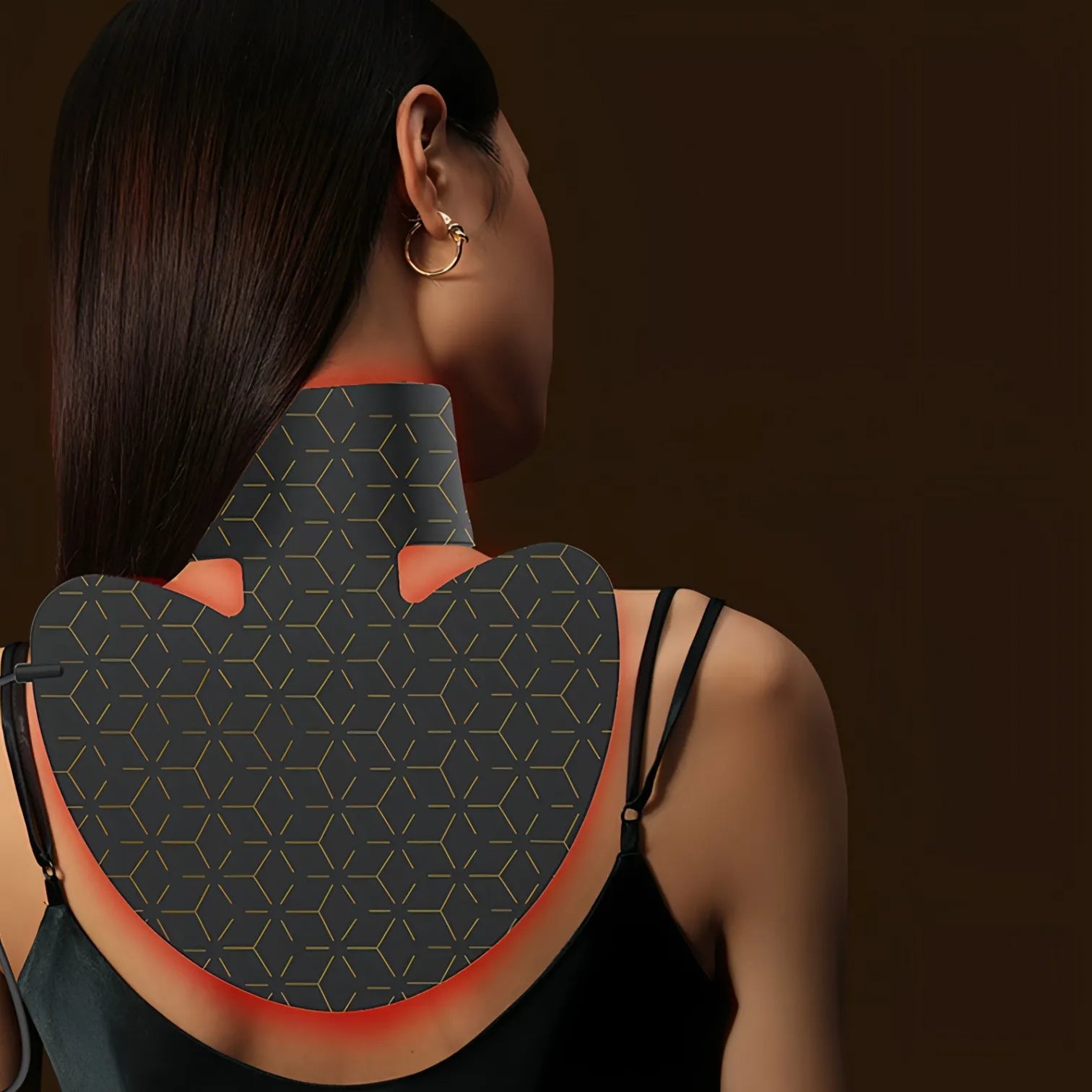 Woman wearing a black Keovy LED Face Mask with geometric pattern on a dark background