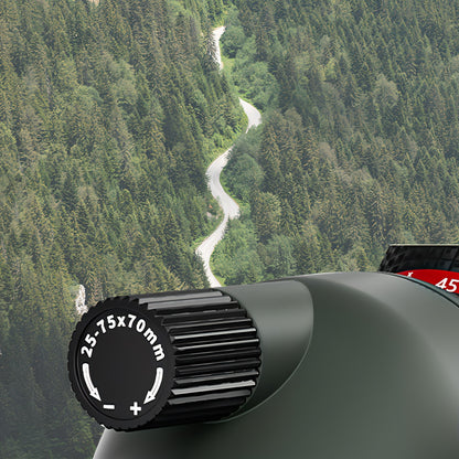 Keovy Spotting Scope lens with focus ring against a scenic background of trees and a river