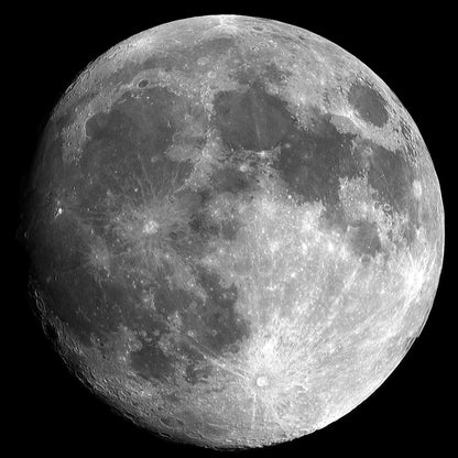 Close-up of the moon's surface with visible craters and textures.
