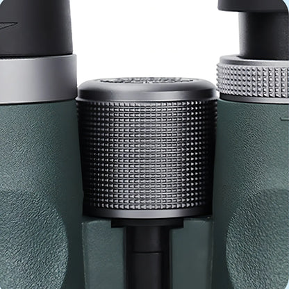 Close-up of a green and black Keswo Binoculars with a textured cylindrical component.