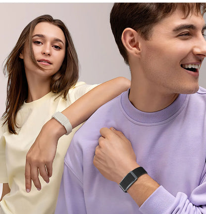 Two people wearing Lenniemart smart Band, one in a light yellow top and the other in a purple sweater.