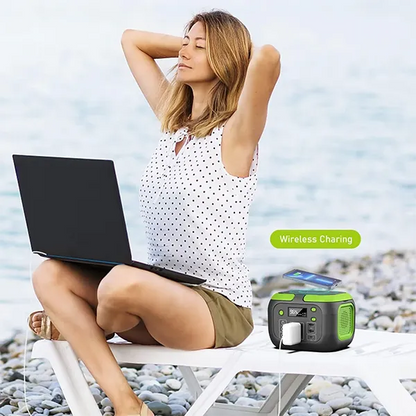 Woman sitting on a beach with a laptop and a MQPower Portable Power Stations, with 'Wireless Charging' text.