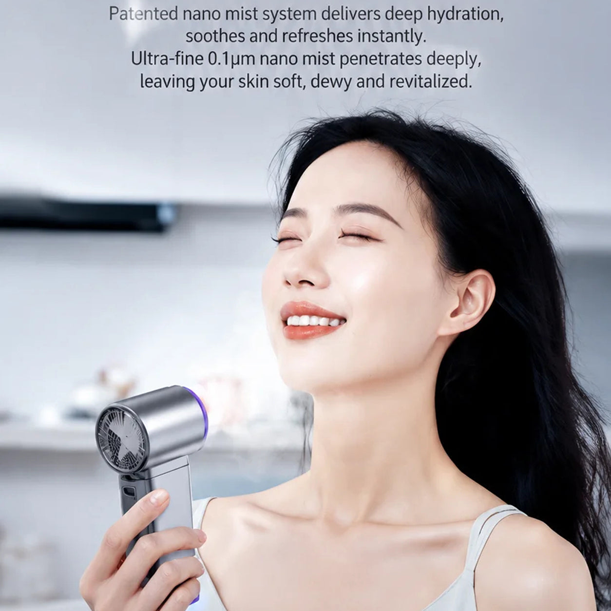 Woman using a MistsyGo Handheld Fan device with product description text on a blurred background