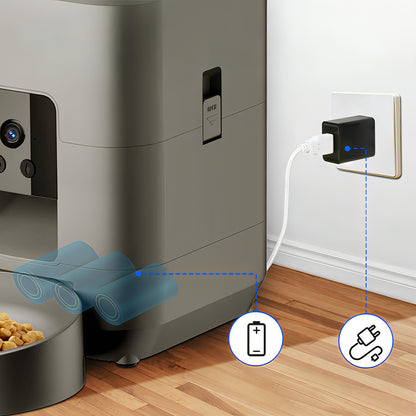 Moravon Pet Feeder with power adapter and battery icon on a wooden floor.