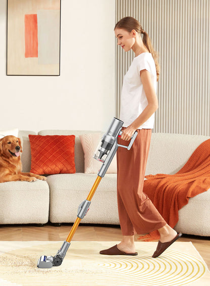 Woman using a Noventrixa Vacuum Cleaner in a living room with a dog sitting on the couch.