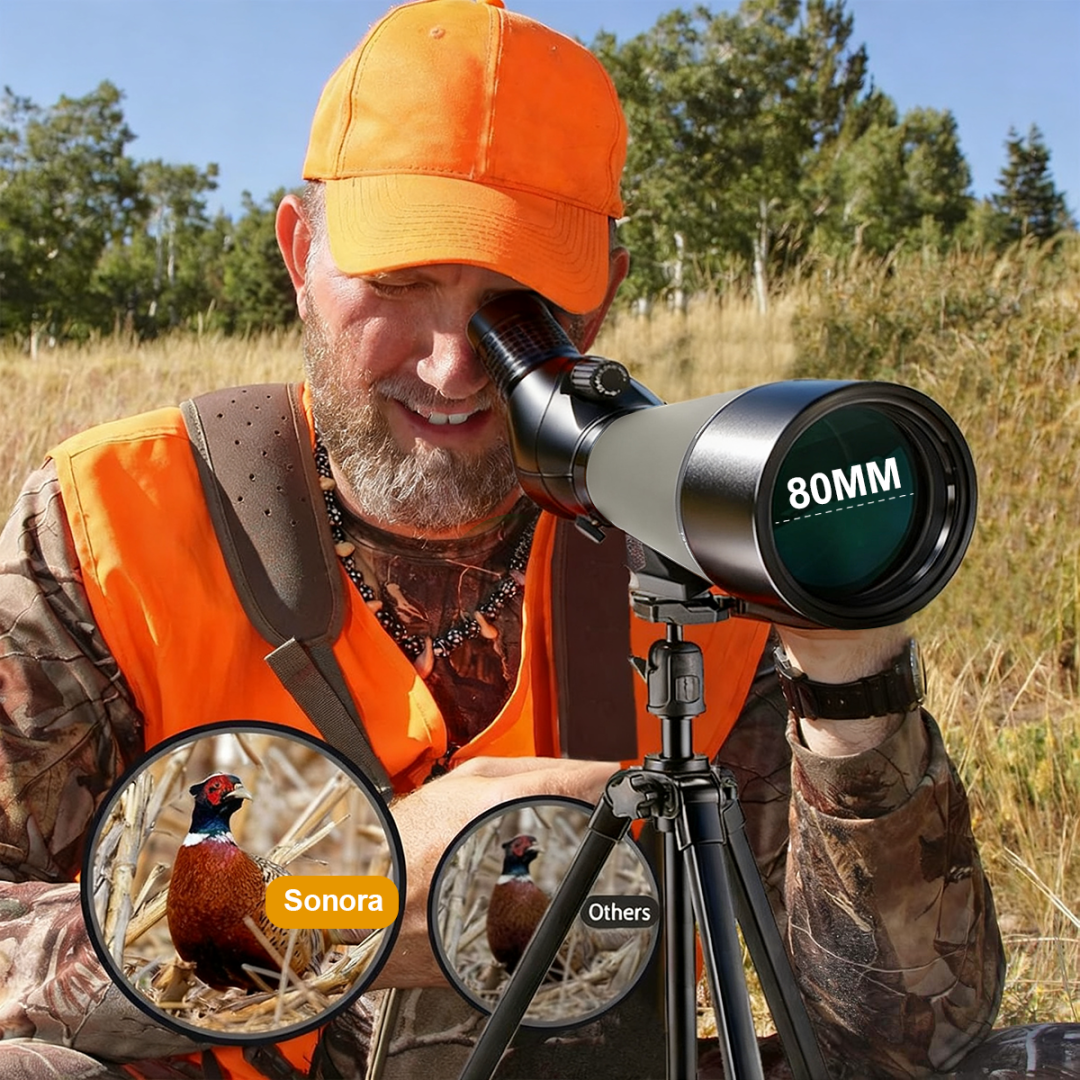 Man in hunting gear using a 80mm telescope in a field with Noxus Spotting Scope