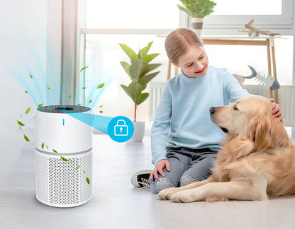 Child and dog sitting on a floor with an Oakerly Air Purifier in the foreground