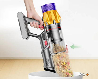 Hand holding a cordless Orazum Vacuum Cleaner with a clear container filled with colorful items on a white background.