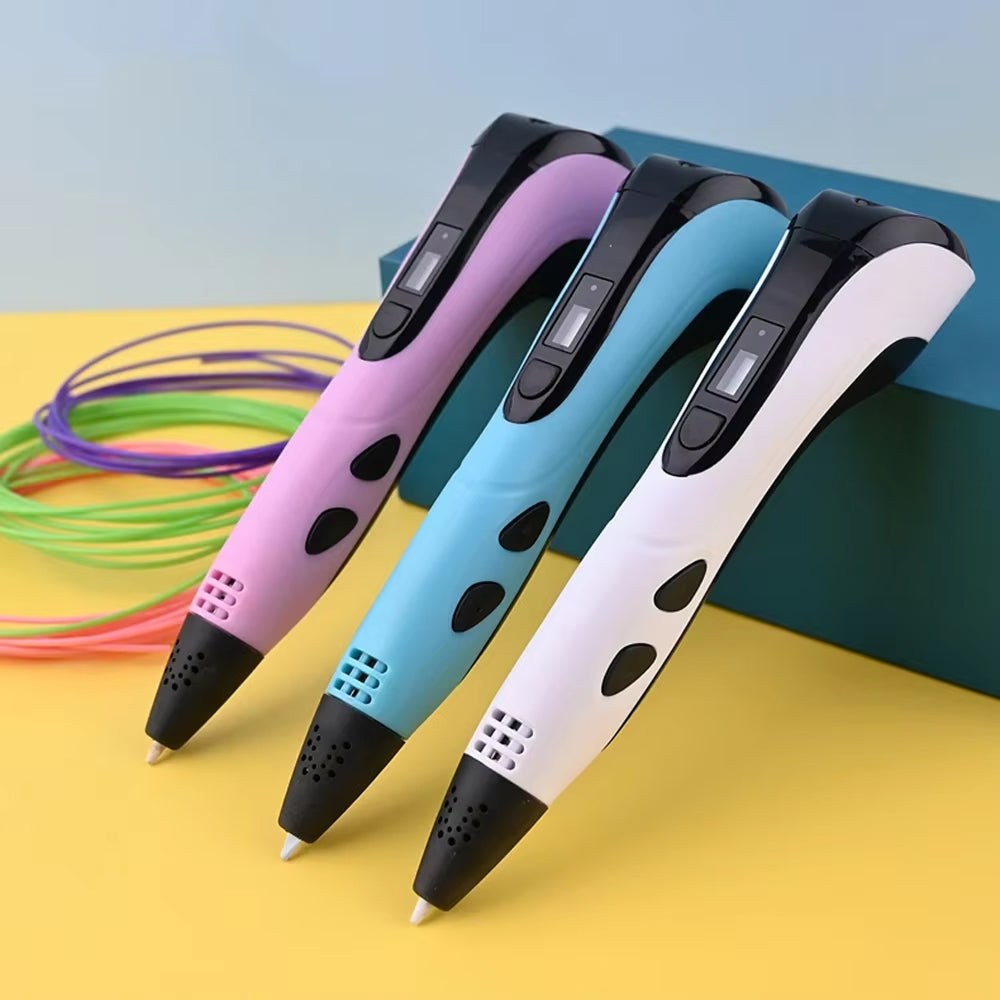 Three PrinpyKid 3D Pen in different colors on a yellow surface with colorful filament.