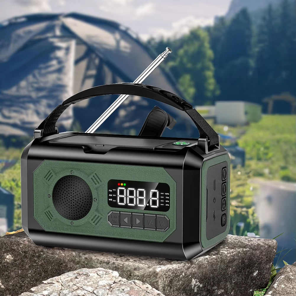 Radiflix Wind Up Radio with digital display on a rock with a scenic background