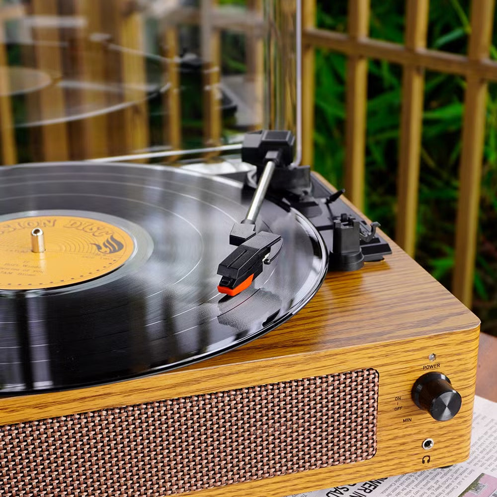 RetroSiDy Record Player with a vinyl record on a blurred outdoor background