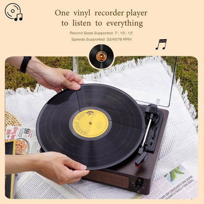 Person placing a RetroSiDy Record Player on a turntable outdoors.