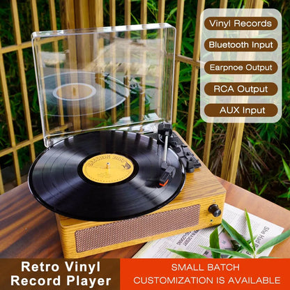 RetroSiDy Record Player with a vinyl record on a wooden surface, surrounded by greenery.