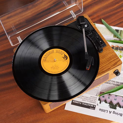 RetroSiDy Record Player on a turntable with a wooden finish, placed on a surface with a magazine underneath.