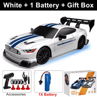 White SkidFlux RC Drift Car with blue stripes, remote control, battery, and packaging on a white background