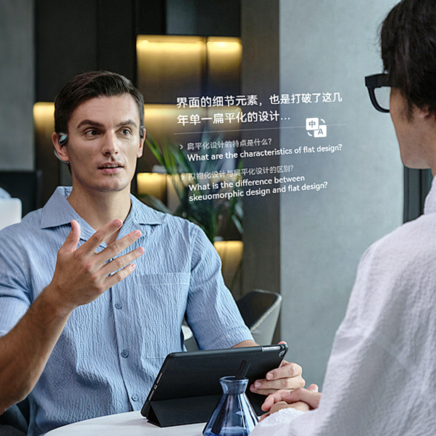 Two men engaged in a conversation with a tablet on a table.
