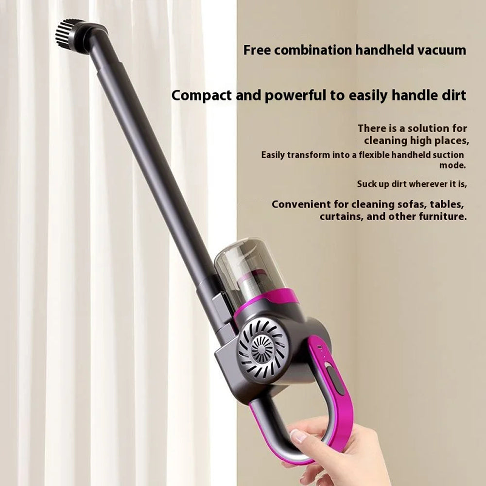 Handheld VaciMatri Mattress Vacuum Cleaner with pink accents held by a hand, against a neutral background.
