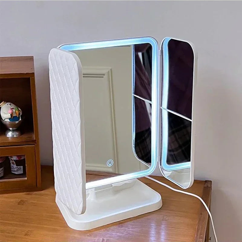 Lighted VeloGleam Lighted Makeup Mirror with a white base on a wooden surface.