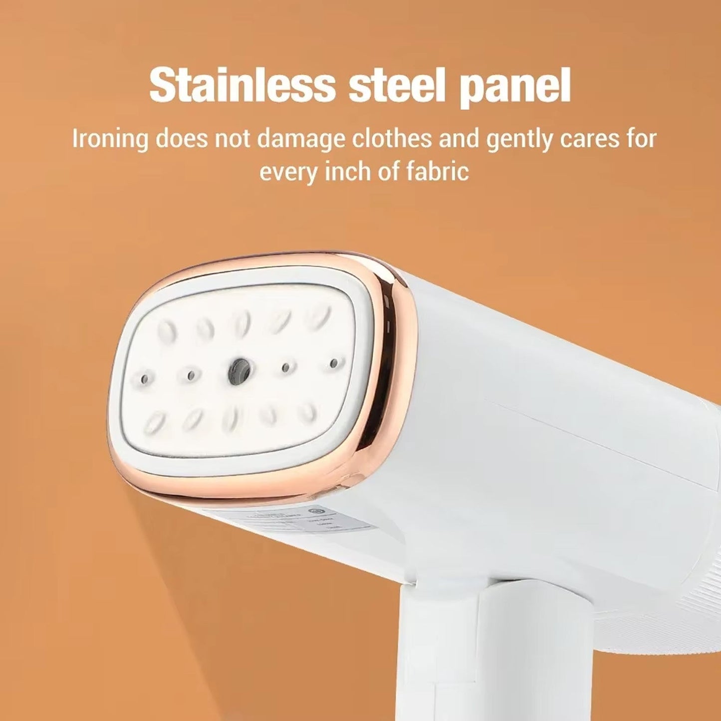 White WandixStim Steamer with rose gold accents on a brown background