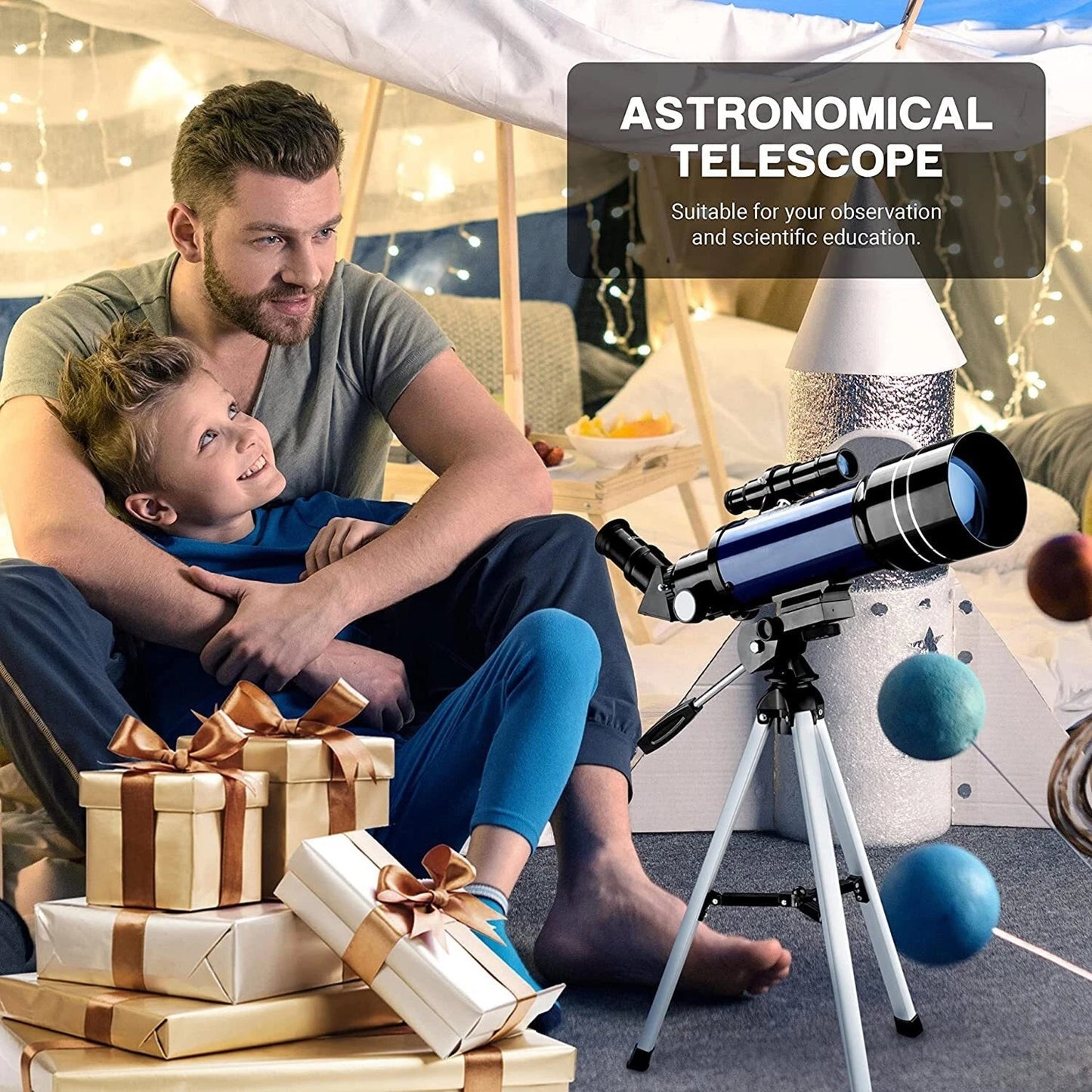 Man and child sitting on the floor with a ZenoGaci Astronomical Telescope and presents in a cozy room.